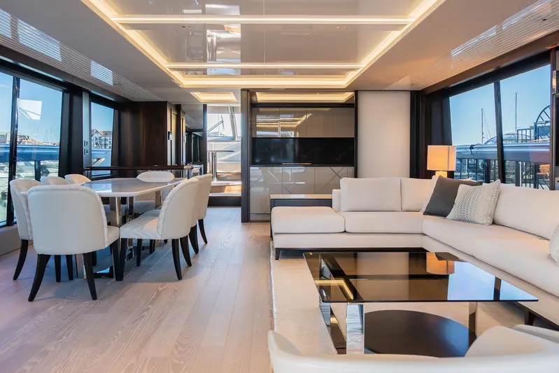  Yacht Photos Pics Luxurious interior of 2025 Sunseeker 90 Ocean yacht with elegant seating and dining area.