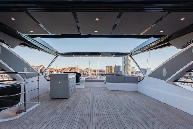  Yacht Photos Pics Luxurious Sunseeker 90 Ocean yacht deck, 2025 model, featuring sleek design and spacious seating.