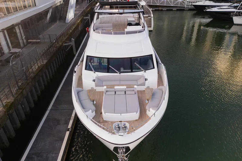  Yacht Photos Pics 2025 Sunseeker 90 Ocean yacht docked, showcasing luxurious deck and sleek design.