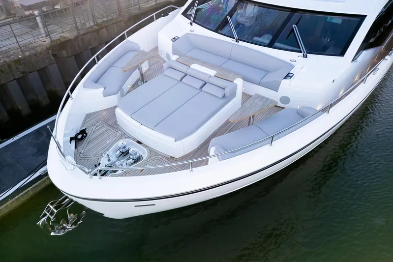  Yacht Photos Pics Luxurious 2025 Sunseeker 90 Ocean yacht with spacious deck and elegant seating area.