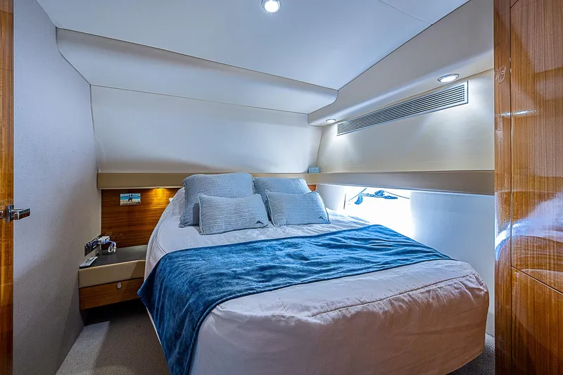 Reel Rodeo Yacht Photos Pics Luxurious bedroom interior of 2014 Maritimo 470 Offshore Convertible yacht.