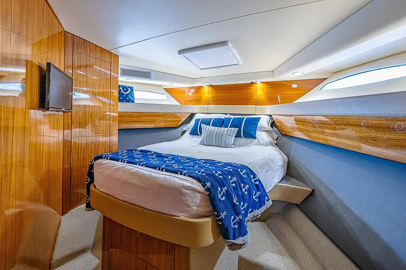 Reel Rodeo Yacht Photos Pics Luxurious bedroom in a 2014 Maritimo 470 Offshore Convertible yacht.