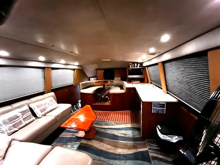 Badfish Yacht Photos Pics Interior of 1998 Ocean Yachts 40 Super Sport with modern furnishings and ample seating.