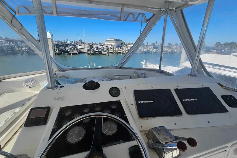 Badfish Yacht Photos Pics Helm of 1998 Ocean Yachts 40 Super Sport with marina view.