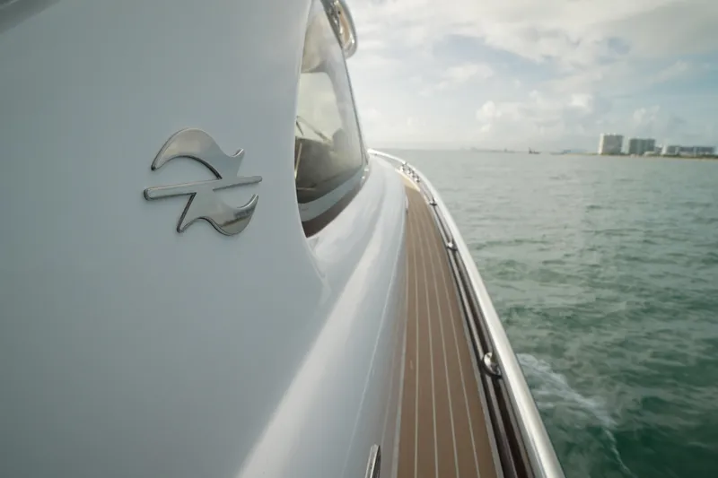 Our Trade Yacht Photos Pics 2013 Zeelander Z44 yacht cruising on open water, showcasing sleek design and logo.