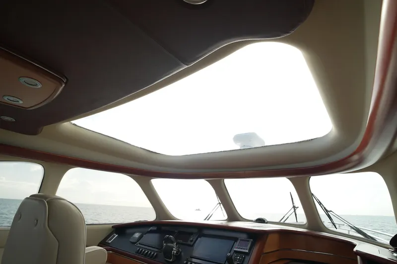 Our Trade Yacht Photos Pics Interior view of 2013 Zeelander Z44 yacht with panoramic windows and luxurious dashboard.