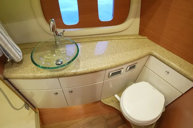 Our Trade Yacht Photos Pics Luxurious bathroom in 2013 Zeelander Z44 yacht with glass sink and modern fixtures.