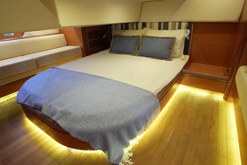 Our Trade Yacht Photos Pics Luxurious bedroom interior of 2013 Zeelander Z44 yacht with ambient lighting and elegant decor.