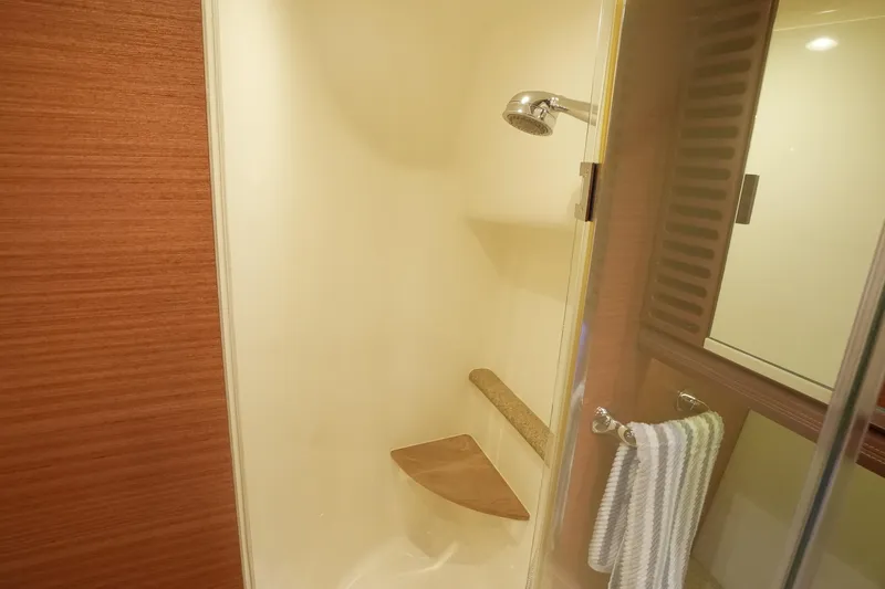 Our Trade Yacht Photos Pics Shower area in 2013 Zeelander Z44 yacht, featuring wooden accents and modern fixtures.