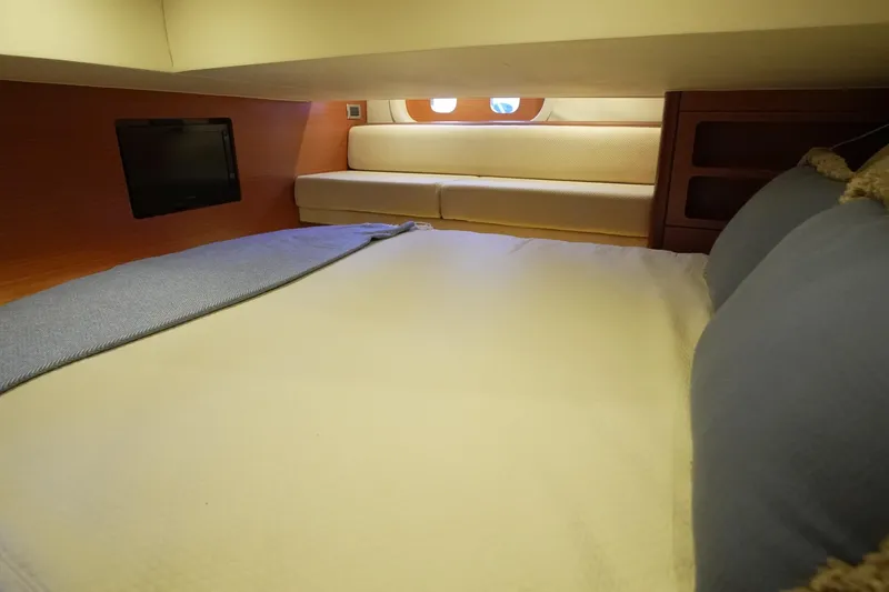 Our Trade Yacht Photos Pics Cozy cabin interior of 2013 Zeelander Z44 yacht with bed and seating area.