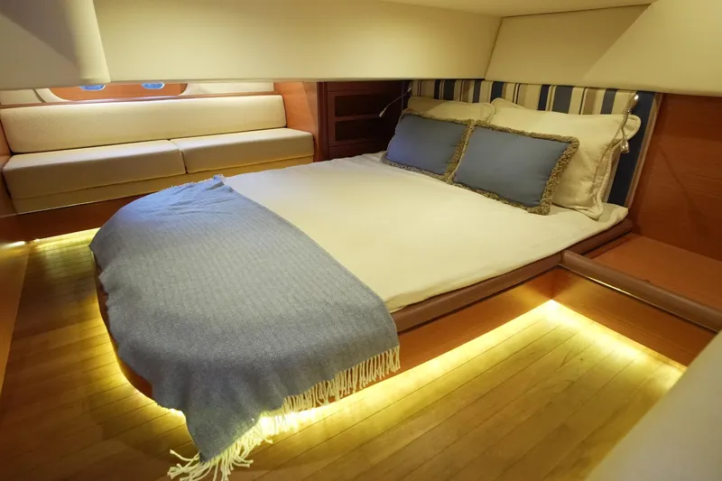 Our Trade Yacht Photos Pics Luxurious cabin interior of 2013 Zeelander Z44 yacht with cozy bed and ambient lighting.