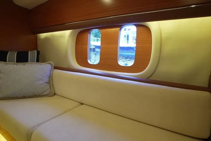 Our Trade Yacht Photos Pics Luxurious interior of 2013 Zeelander Z44 yacht with elegant seating and window view.