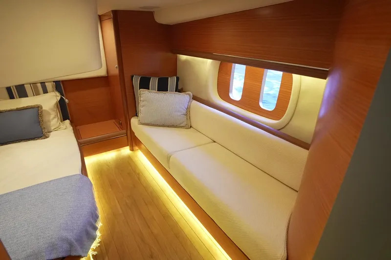 Our Trade Yacht Photos Pics Luxurious interior of 2013 Zeelander Z44 yacht with cozy seating and elegant wood finish.