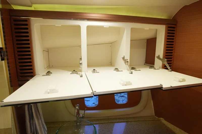 Our Trade Yacht Photos Pics Interior storage cabinets on a 2013 Zeelander Z44 yacht, featuring open white compartments.