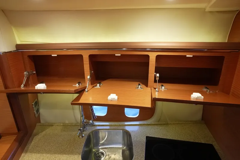 Our Trade Yacht Photos Pics Luxurious 2013 Zeelander Z44 yacht interior with wooden cabinets and modern sink.