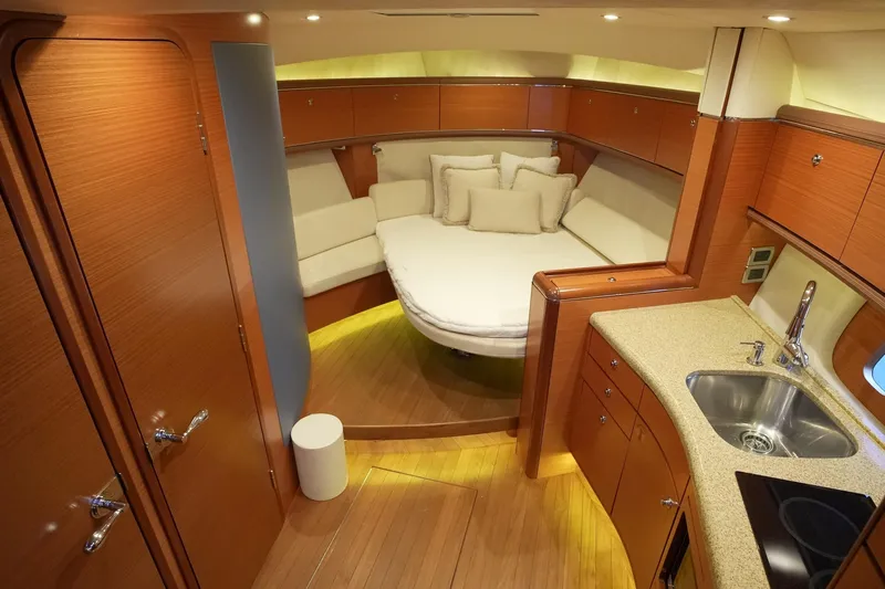 Our Trade Yacht Photos Pics Luxurious 2013 Zeelander Z44 yacht interior with cozy seating and modern kitchenette.