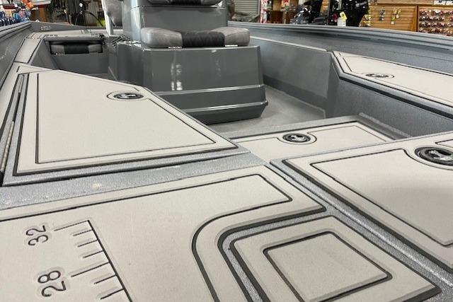 2026 Excel 220 Bay Pro Elite boat interior with storage compartments and seating.