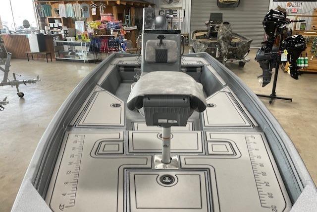 2026 Excel 220 Bay Pro Elite boat interior with seating and storage compartments.
