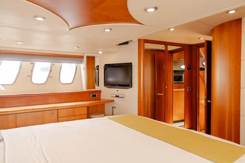  Yacht Photos Pics Luxurious interior of 2008 Sunseeker Manhattan 60 yacht, featuring elegant wood finishes and modern amenities.