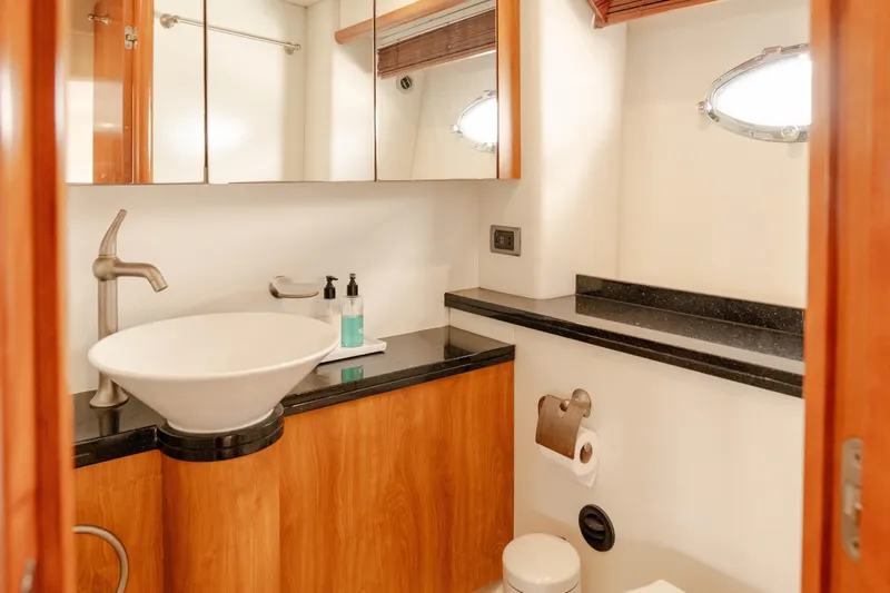  Yacht Photos Pics Luxurious bathroom in 2008 Sunseeker Manhattan 60 yacht with modern fixtures and wood accents.