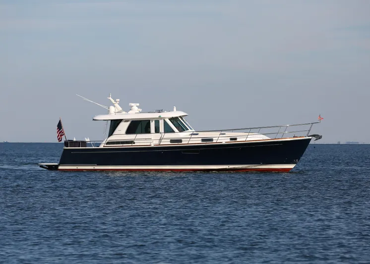 Skydog Yacht Photos Pics 2017 Sabre 48 Salon Express yacht cruising on open water.