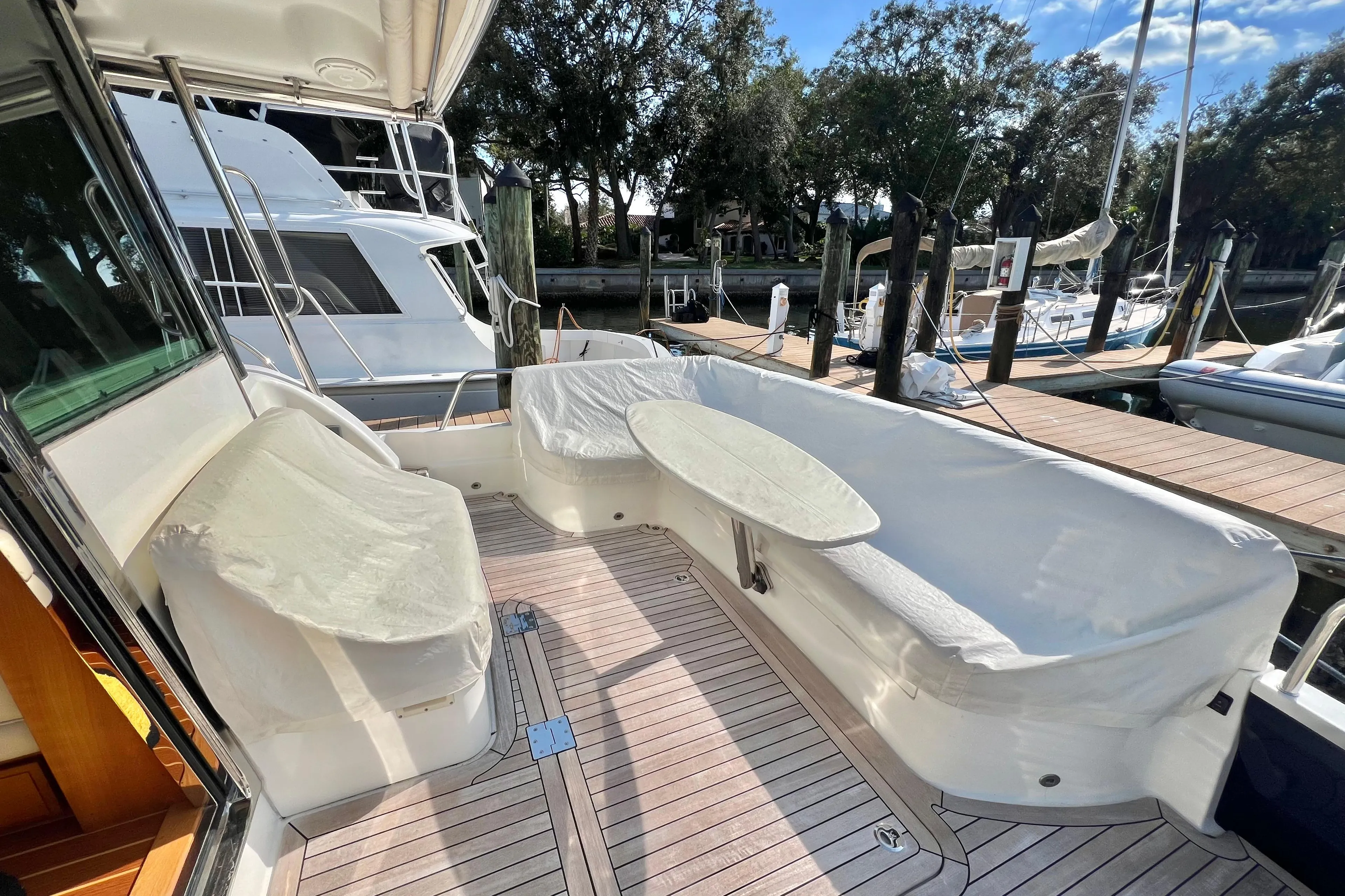 2017 Sabre 48 Salon Express yacht with spacious outdoor seating and table on deck.