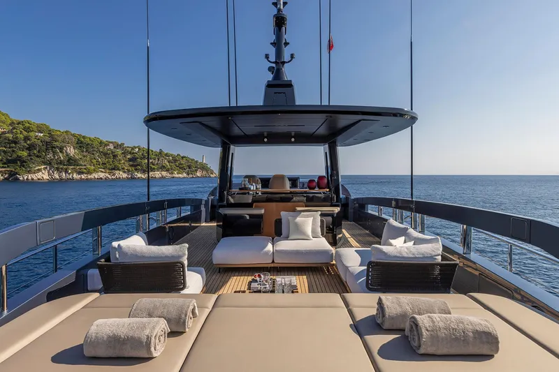 Yacht Photos Pics Luxurious 2025 Pershing GTX116 yacht deck with plush seating and ocean view.