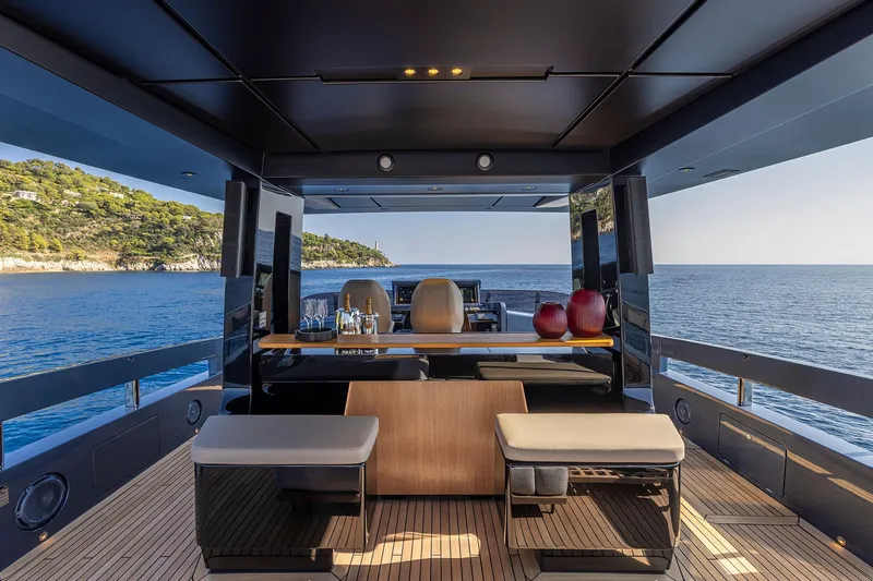  Yacht Photos Pics Luxurious 2025 Pershing GTX116 yacht interior with ocean view and elegant seating area.