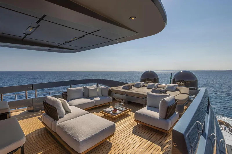  Yacht Photos Pics Luxurious deck of 2025 Pershing GTX116 yacht with elegant seating and ocean view.