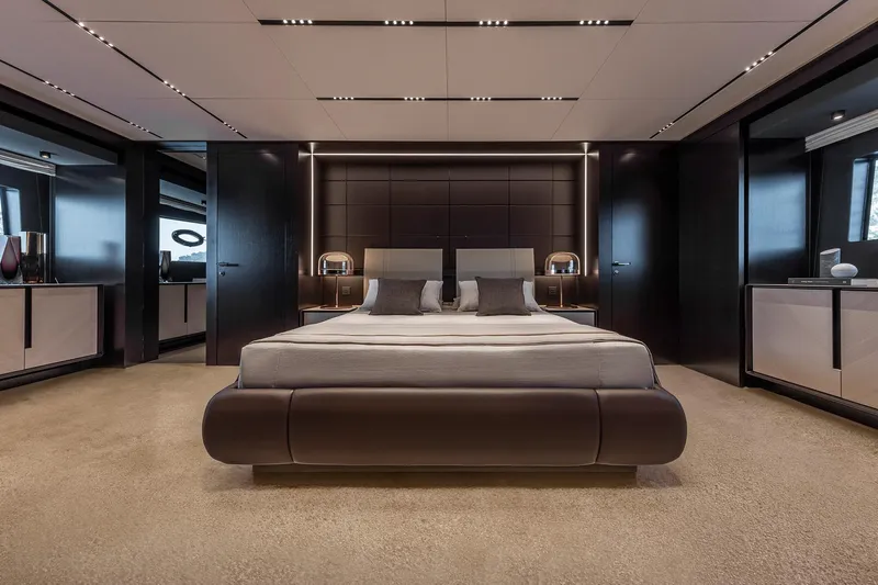 Yacht Photos Pics Luxurious bedroom interior of 2025 Pershing GTX116 yacht, featuring modern design and elegant furnishings.