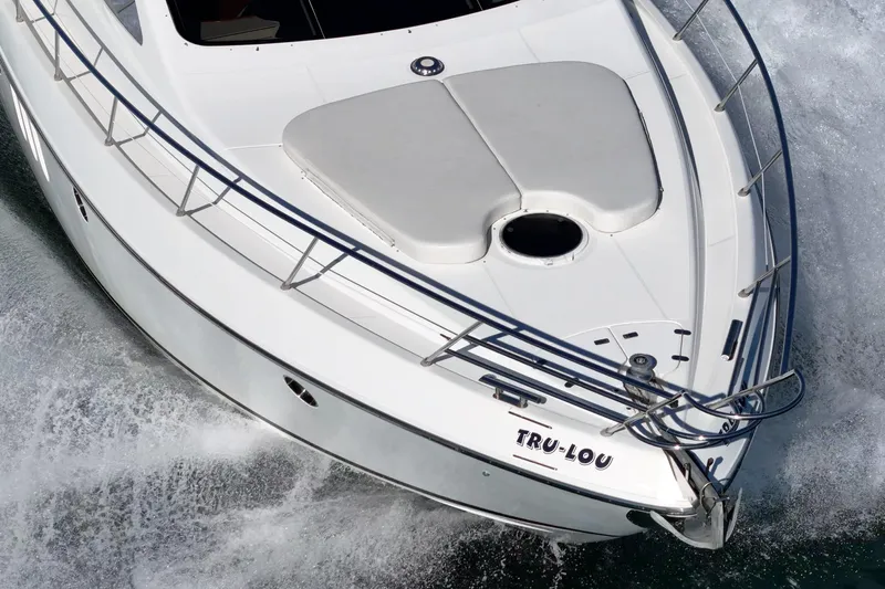  Yacht Photos Pics 2002 Azimut 58 yacht cruising on water, aerial view of bow.