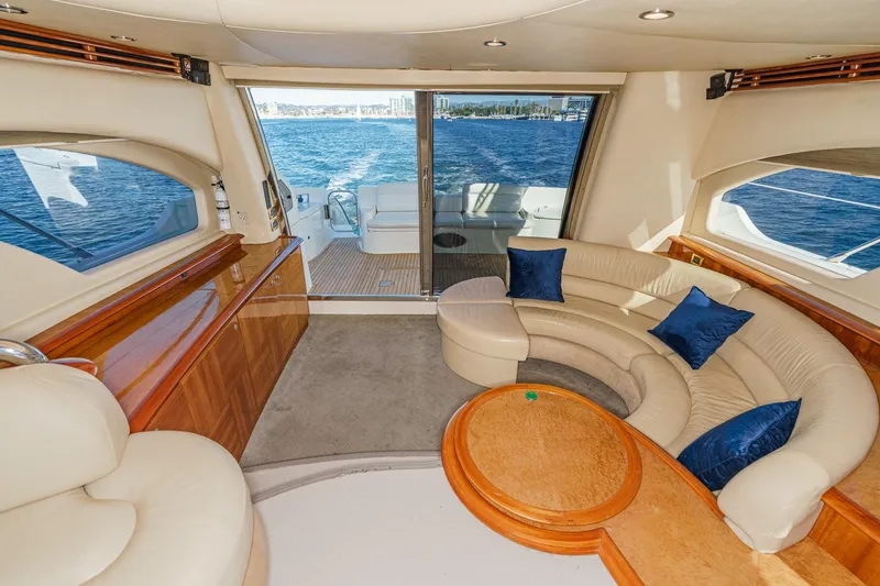  Yacht Photos Pics Luxurious interior of 2002 Azimut 58 yacht with elegant seating and ocean view.