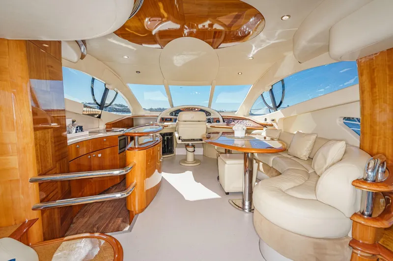  Yacht Photos Pics Luxurious interior of a 2002 Azimut 58 yacht with elegant wood and leather finishes.