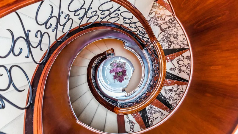 Bella Yacht Photos Pics Spiral staircase with elegant railing inside 2005 Sensation Yachts Sensation 177.