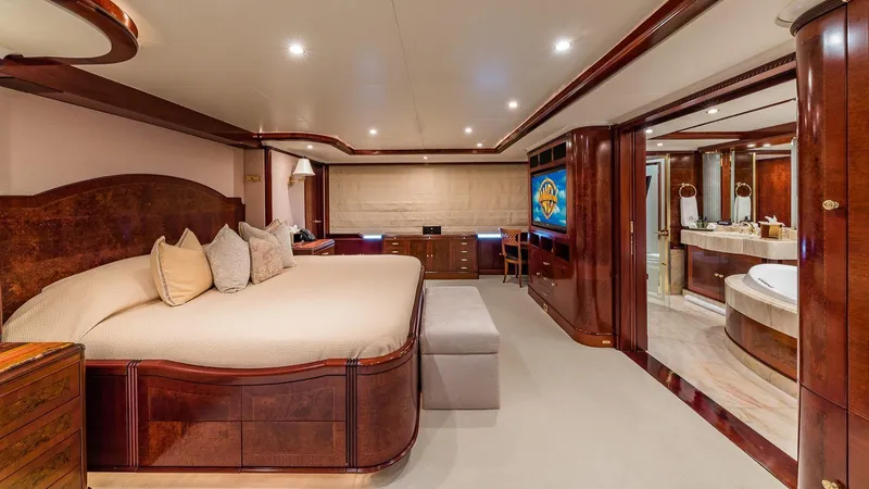 Bella Yacht Photos Pics Luxurious bedroom interior of 2005 Sensation Yachts Sensation 177 with elegant wood finishes.
