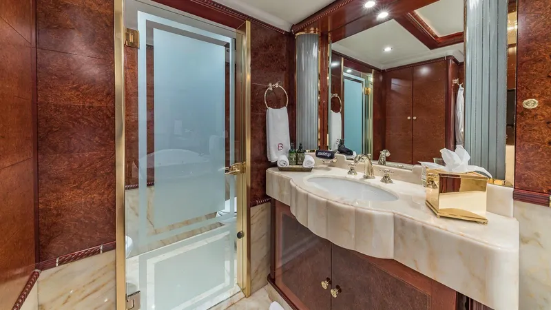 Bella Yacht Photos Pics Luxurious bathroom on 2005 Sensation Yachts Sensation 177, featuring elegant wood and marble finishes.