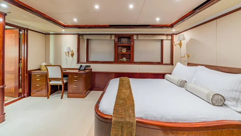 Bella Yacht Photos Pics Luxurious bedroom interior of 2005 Sensation Yachts Sensation 177 with elegant furnishings.