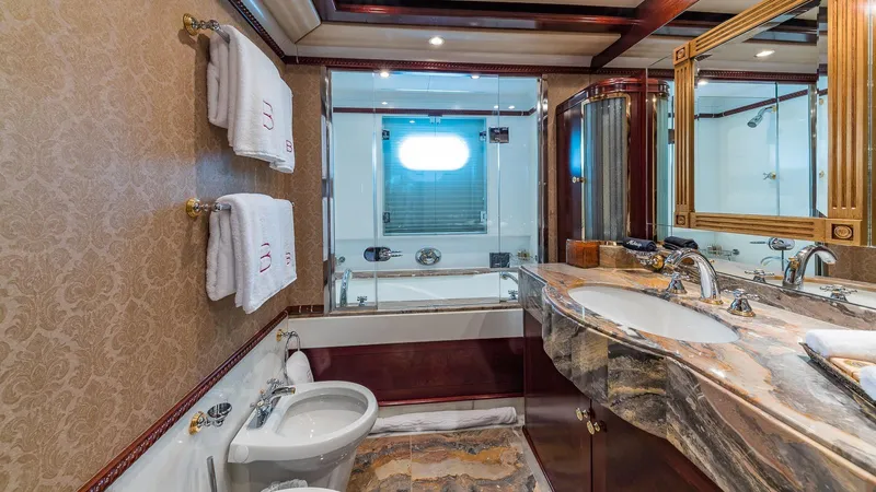 Bella Yacht Photos Pics Luxurious bathroom in 2005 Sensation Yachts Sensation 177, featuring elegant marble countertops.