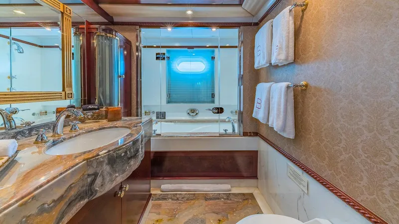 Bella Yacht Photos Pics Luxurious bathroom in 2005 Sensation Yachts Sensation 177, featuring marble sink and elegant decor.