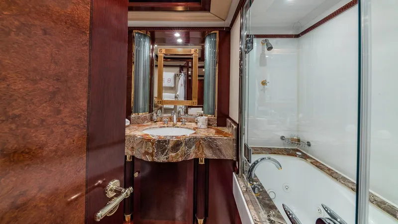 Bella Yacht Photos Pics Luxurious bathroom in 2005 Sensation Yachts Sensation 177, featuring marble sink and elegant fixtures.