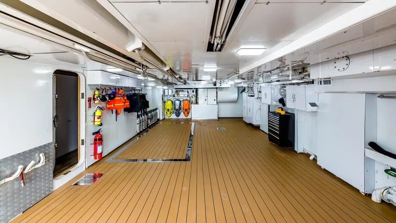 Bella Yacht Photos Pics Spacious interior of 2005 Sensation Yachts Sensation 177 with safety equipment and wooden flooring.