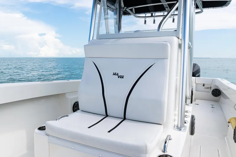 Yacht Photos Pics 2018 SeaVee 29 boat interior with white seating, ocean view in background.