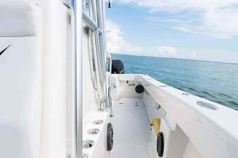  Yacht Photos Pics 2018 SeaVee 29 boat interior with ocean view, featuring sleek white design and stainless steel details.