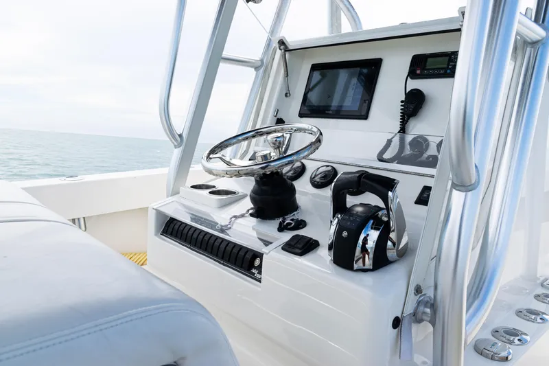  Yacht Photos Pics 2018 SeaVee 29 boat console with steering wheel and navigation equipment.