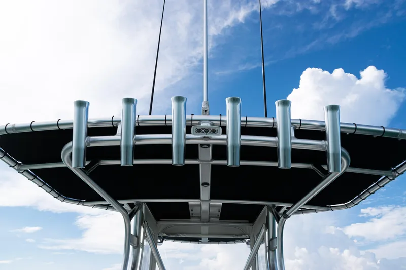 Yacht Photos Pics 2018 SeaVee 29 boat with rod holders against a blue sky background.