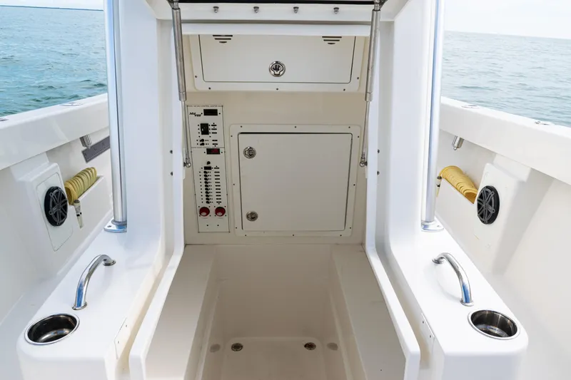  Yacht Photos Pics 2018 SeaVee 29 boat interior with control panel and storage compartments.
