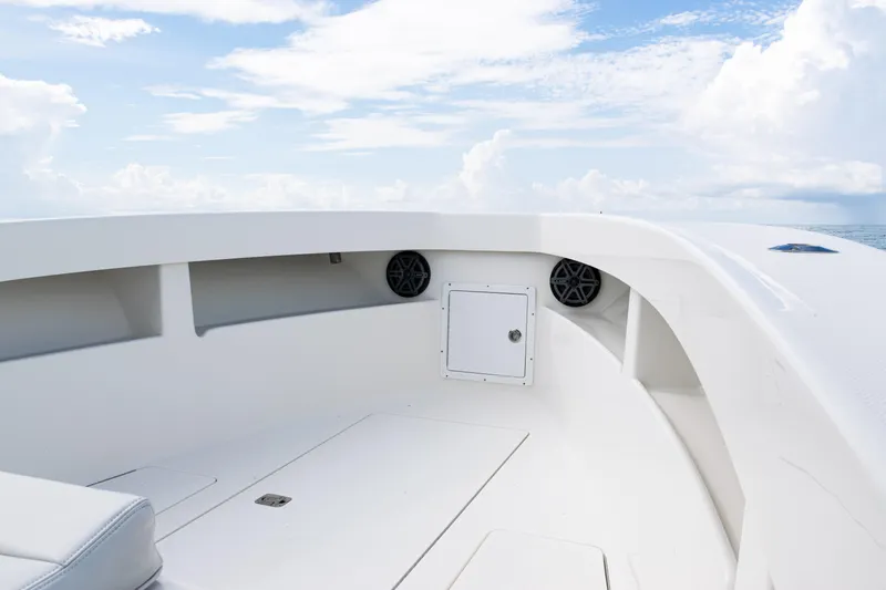  Yacht Photos Pics 2018 SeaVee 29 boat interior with speakers, storage, and ocean view.