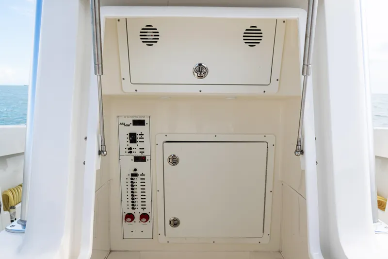  Yacht Photos Pics 2018 SeaVee 29 boat control panel with storage compartments, ocean in background.