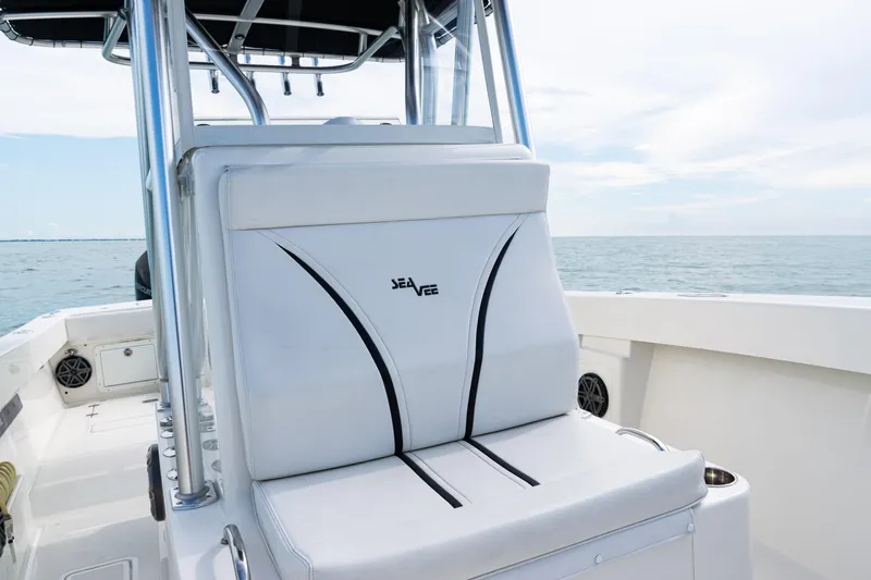  Yacht Photos Pics 2018 SeaVee 29 boat interior with cushioned seating and ocean view.
