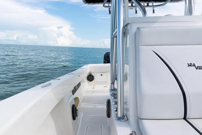  Yacht Photos Pics 2018 SeaVee 29 boat on open water, featuring sleek white seating and clear blue skies.